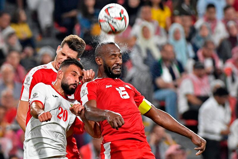 Palestine's Abdellatif Bahdari, right, vies for the header with Palestine's Nazmi Albadawi. AFP