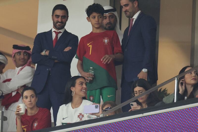 Rodriguez, bottom, and son Cristiano Ronaldo Jr, centre, attend the World Cup quarterfinal match between Morocco and Portugal at the Al-Thumama Stadium in Doha. AFP