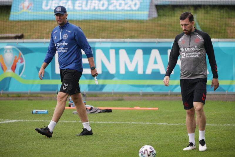 Denmark's Pierre-Emile Hojbjerg and coach Kasper Hjulmand during a training session. Reuters
