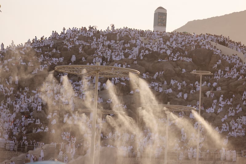 Water mist is sprayed to help pilgrims on Mount Arafat keep cool despite the extreme high temperatures during Hajj. Reuters