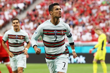 BUDAPEST, HUNGARY - JUNE 15: Cristiano Ronaldo of Portugal celebrates after scoring their side's second goal during the UEFA Euro 2020 Championship Group F match between Hungary and Portugal at Puskas Arena on June 15, 2021 in Budapest, Hungary. (Photo by Bernadett Szabo - Pool/Getty Images)