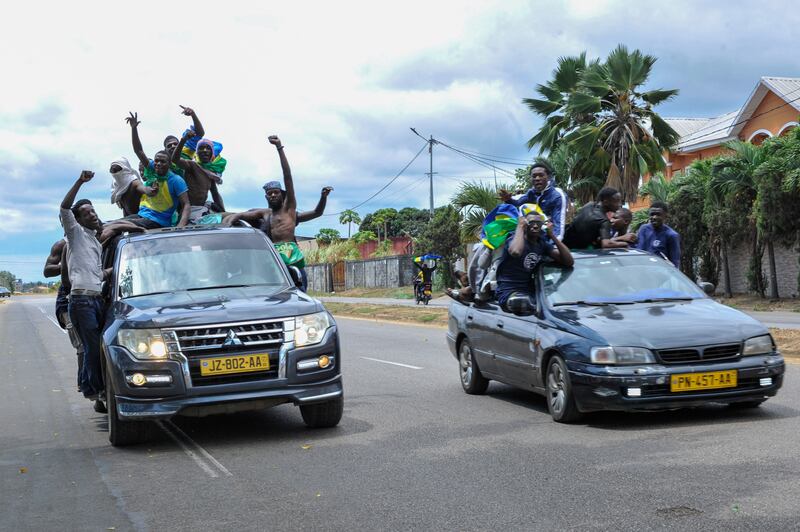 Gabonese people celebrate after the military announced the removal of Mr Bongo. EPA