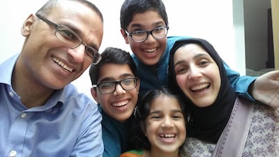 Amir, a British-Pakistani who was raised as an expat in Abu Dhabi, and his wife, Yasmin, pictured with their family.