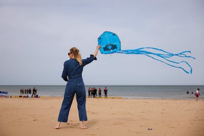 A woman helps her daughter fly a kite on the beach on Margate beach in south-east England. Winds of 70mph may hit Cornwall in the south-west. Getty Images