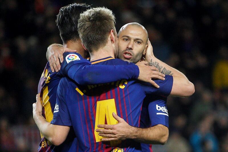 epa06431956 FC Barcelona's players Javier Mascherano (R) and Andre Gomes (L) congratulate Ivan Rakitic (C) after scoring the fifth goal against Celta Vigo during their Spanish King's Cup round of 16 second leg soccer match played at Camp Nou stadium in Barcelona, Spain, 11 January 2018.  EPA/QUIQUE GARCIA
