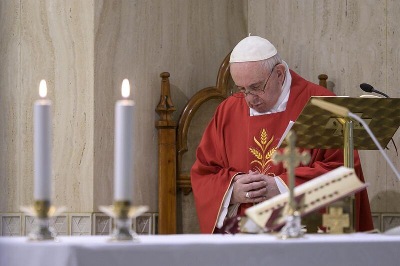 This photo taken and released on May 14, 2020 by the Vatican Media shows Pope Francis celebrating a private and live broadcast morning mass at the chapel of his Santa Marta residence in The Vatican, during the lockdown aimed at curbing the spread of the COVID-19 infection, caused by the novel coronavirus.  RESTRICTED TO EDITORIAL USE - MANDATORY CREDIT "AFP PHOTO / VATICAN MEDIA" - NO MARKETING - NO ADVERTISING CAMPAIGNS - DISTRIBUTED AS A SERVICE TO CLIENTS
 / AFP / VATICAN MEDIA / Handout / RESTRICTED TO EDITORIAL USE - MANDATORY CREDIT "AFP PHOTO / VATICAN MEDIA" - NO MARKETING - NO ADVERTISING CAMPAIGNS - DISTRIBUTED AS A SERVICE TO CLIENTS
