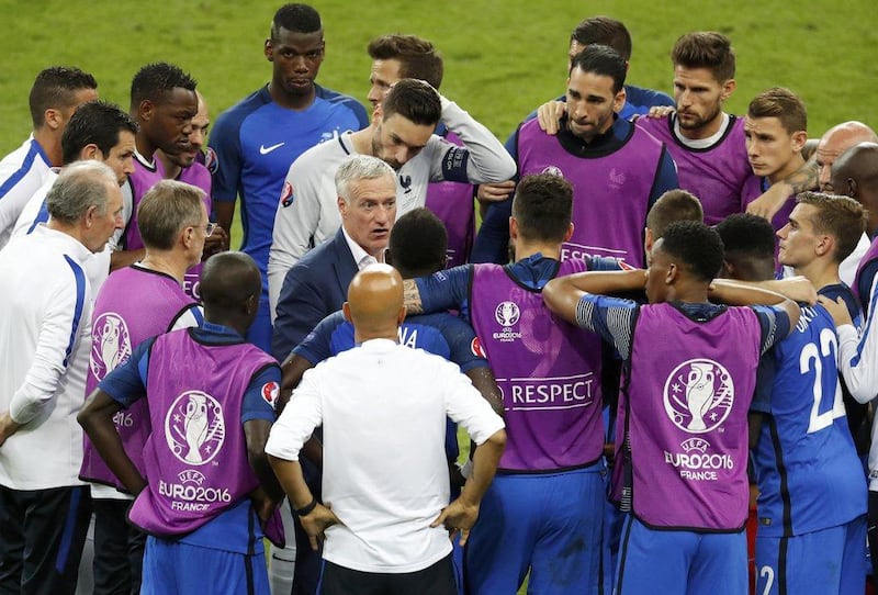 France manager Didier Deschamps talks to his players before extra time during the Uefa Euro 2016 Final against Portugal at the Stade de France, 10 July 2016. Charles Platiau / Reuters