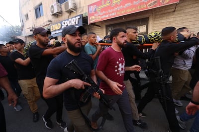 Relatives and militants carry the bodies of Palestinians killed following a drone strike on the Jenin refugee camp in the occupied West Bank, October 25, 2023. EPA