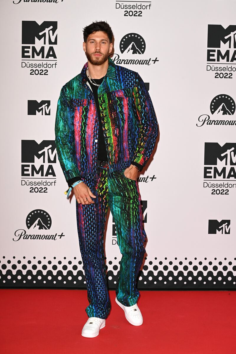'Love Island' star Jack Fowler wears colourful denim. Getty Images 