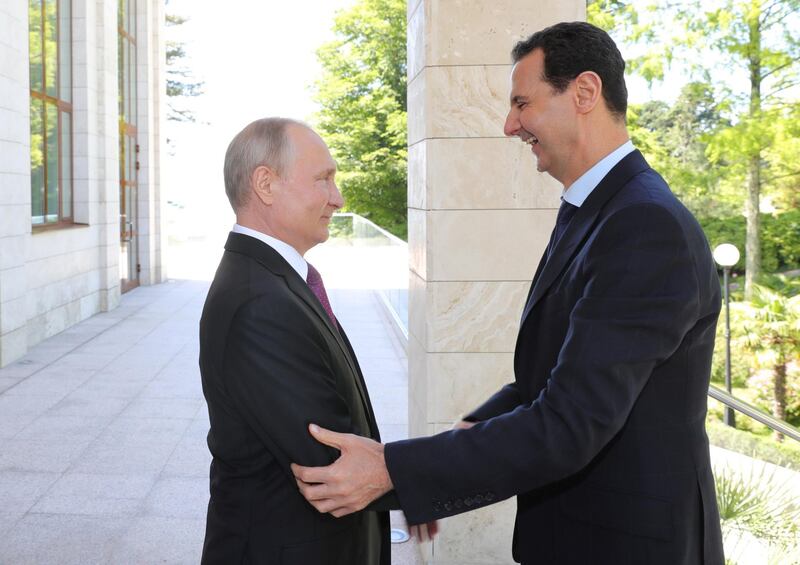 Russian President Vladimir Putin welcomes Syrian President Bashar al-Assad during their meeting in the Black Sea resort of Sochi, Russia May 17, 2018. Sputnik/Mikhail Klimentyev/Kremlin via REUTERS ATTENTION EDITORS - THIS IMAGE WAS PROVIDED BY A THIRD PARTY.     TPX IMAGES OF THE DAY