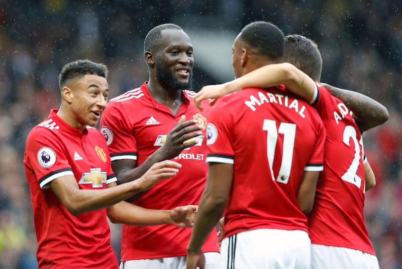 Manchester United's Romelu Lukaku, second left, celebrates scoring his side's fourth goal of the game with team-mates during the English Premier League soccer match between Manchester United and Crystal Palace at Old Trafford, Manchester, England. Saturday, Sept. 30, 2017. (Martin Rickett/PA via AP)