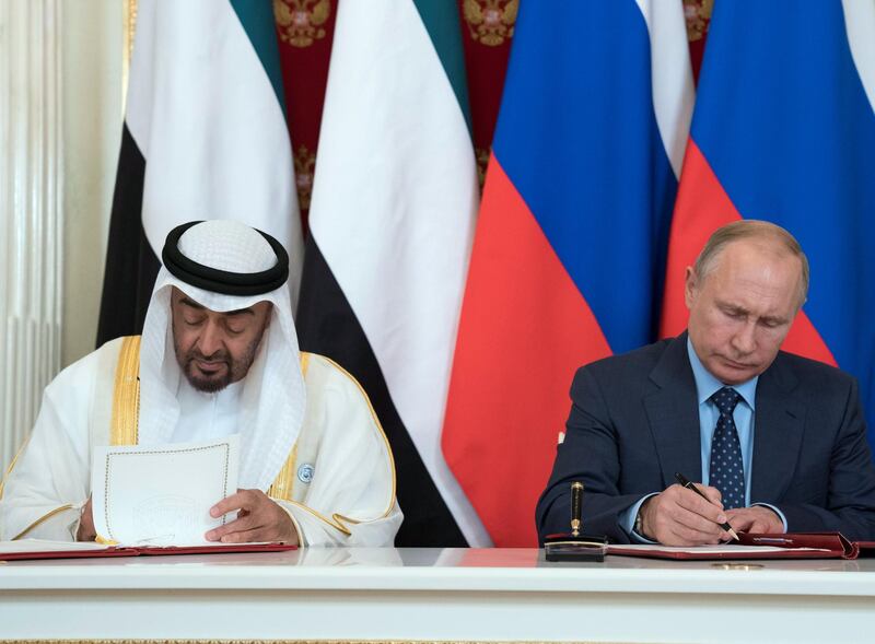 MOSCOW, RUSSIA - June 01, 2018: HH Sheikh Mohamed bin Zayed Al Nahyan, Crown Prince of Abu Dhabi and Deputy Supreme Commander of the UAE Armed Forces (L) and  HE Vladimir Putin Vladimirovich, President of Russia (R) sign a memorandum of understanding, at the Kremlin Palace.

( Mohamed Al Hammadi / Crown Prince Court - Abu Dhabi )
---