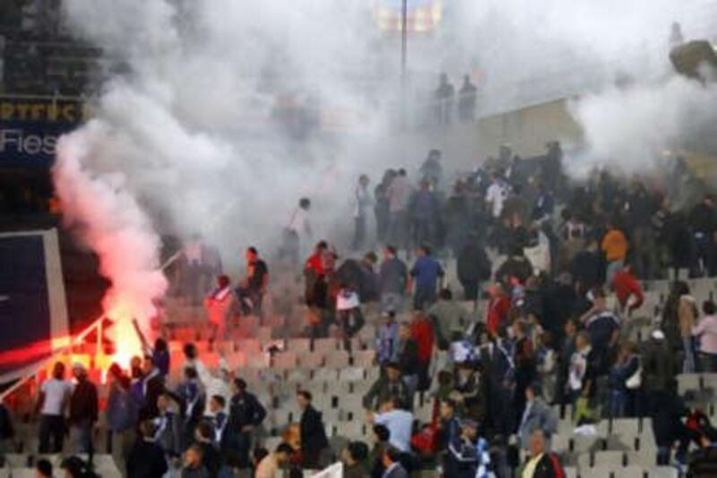 Crowd trouble breaks out between Espanyol and Barcelona fans in the first Catalan derby of the season.