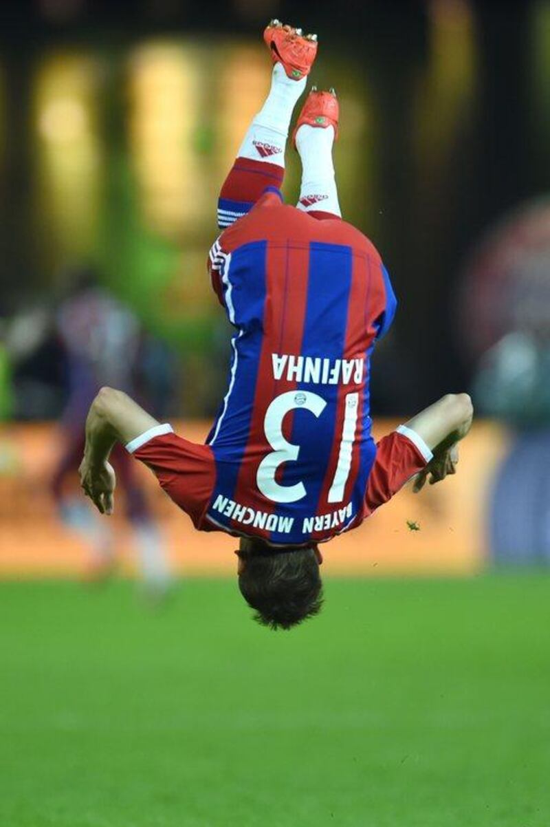 Bayern Munich defender Rafinha jumps to celebrate winning the German Cup final on Saturday over Borussia Dortmund. Patrik Stollarz / AFP / May 17, 2014