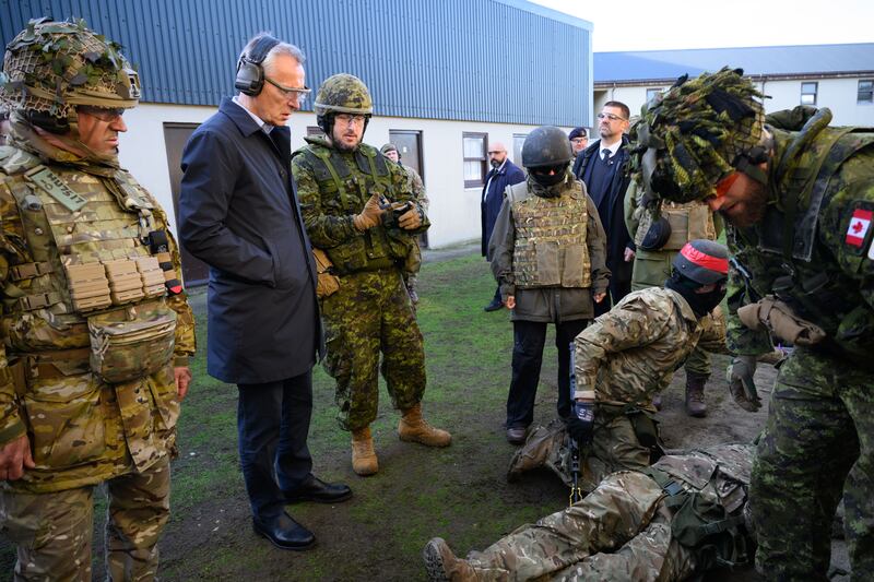Jens Stoltenberg watches the exercises. 