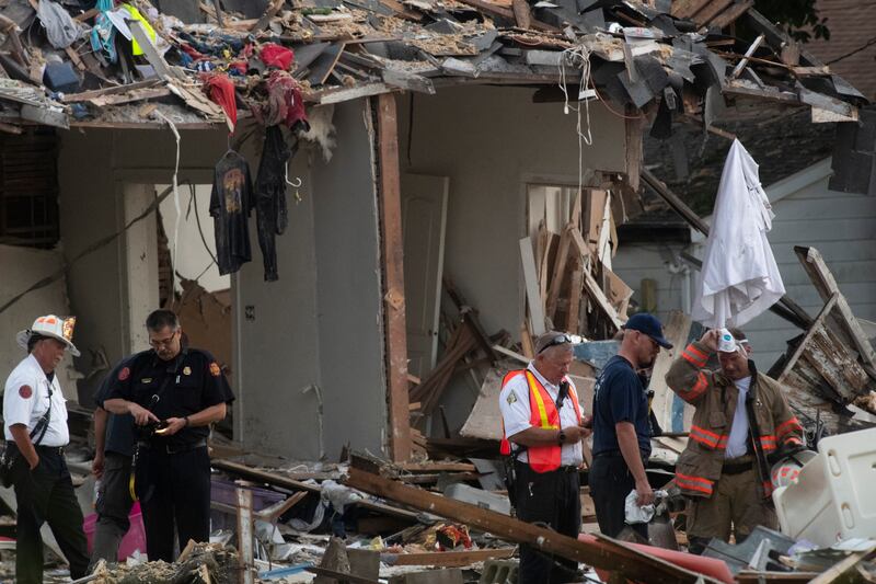Authorities work to determine the cause of the explosion. AP