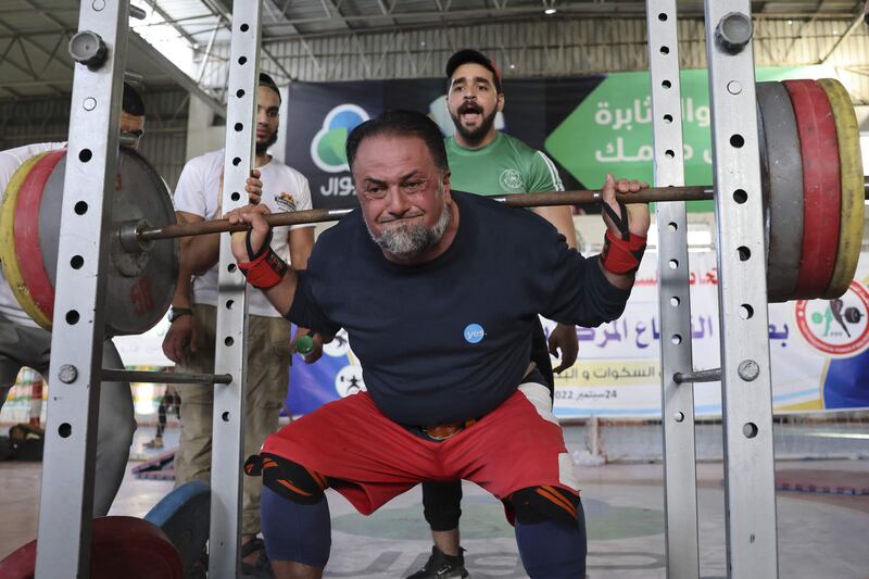 A Palestinian takes part in a weightlifting championship in the southern Gaza Strip town of Khan Yunis. 