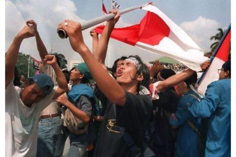 Students celebrate the resignation of Indonesian President Suharto at the parliamentary complex in Jakarta in 1998. Kemal Jufri / AFP