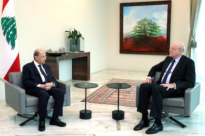 Lebanese President Michel Aoun (L) meets with former Lebanese Prime Minister Najib Mikati (R) at the presidential palace in Baabda, east of Beirut, Lebanon, 26 July 2021. Dalati & Nohra / EPA