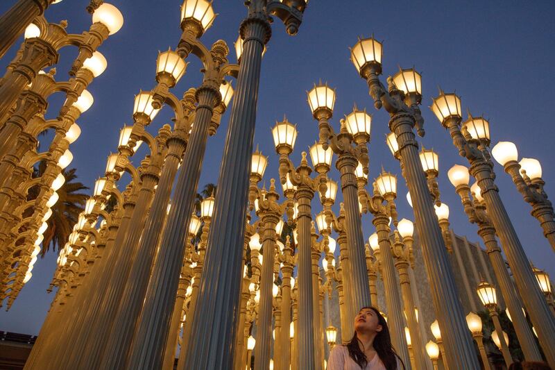 Visitors view the Urban Light art installation during a commemoration of its 10 year anniversary at the Los Angeles County Museum of Art (LACMA) in California. Eugene Garcia / EPA