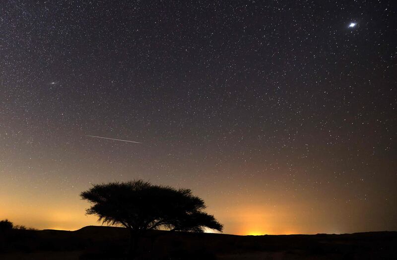 A Perseid meteor streaks across the sky above the Negev desert near the city of Mitzpe Ramon in Israel.