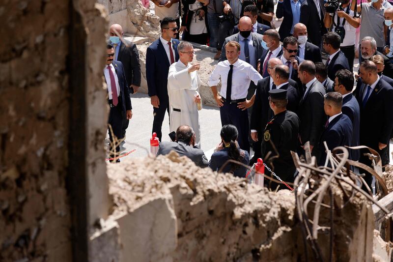 French President Emmanuel Macron tours the Our Lady of the Hour Church in Iraq's second city of Mosul. AFP