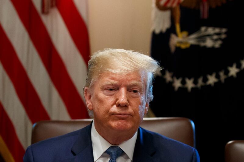 President Donald Trump pauses while speaking as reporters leave the room during a Cabinet meeting in the Cabinet Room of the White House, Tuesday, July 16, 2019, in Washington. (AP Photo/Alex Brandon)