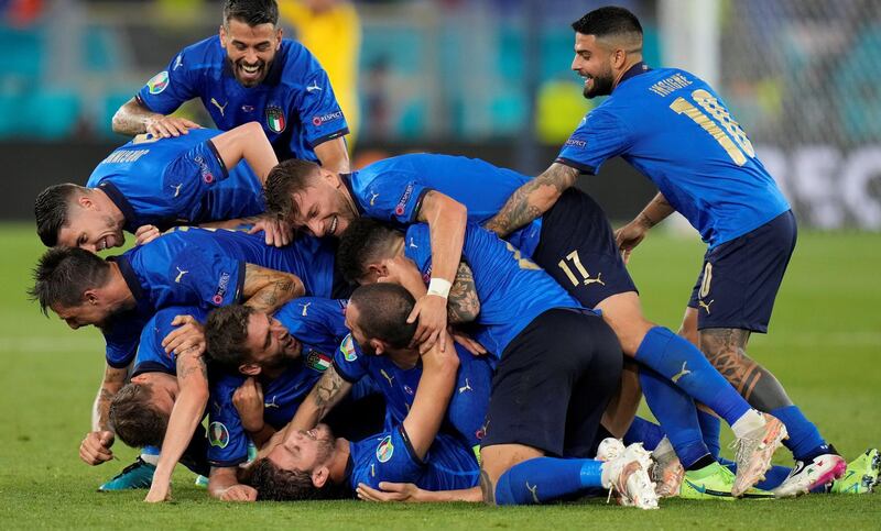 Manuel Locatelli is mobbed by teammates after scoring Italy's second goal in their Euro 2020 win over Switzerland at the Stadio Olimpico in Rome on Wednesday, June 16. Reuters