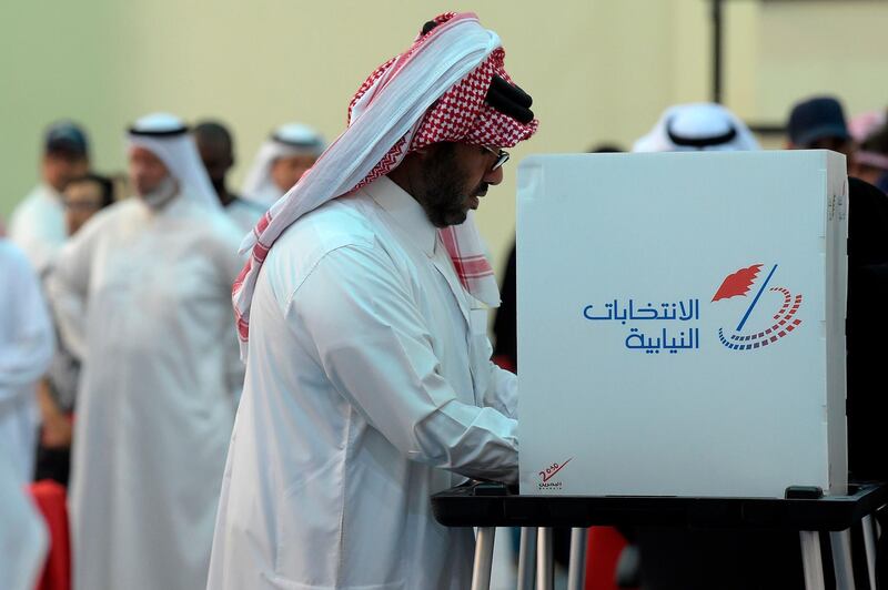 A Bahraini casts his ballot at a polling station in Al-Muharraq, Bahrain. AFP