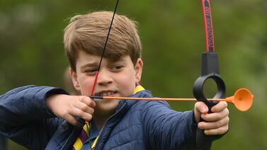 Prince George of Wales tries his hand at archery at the 3rd Upton Scouts Hut, in Slough, near London. Getty