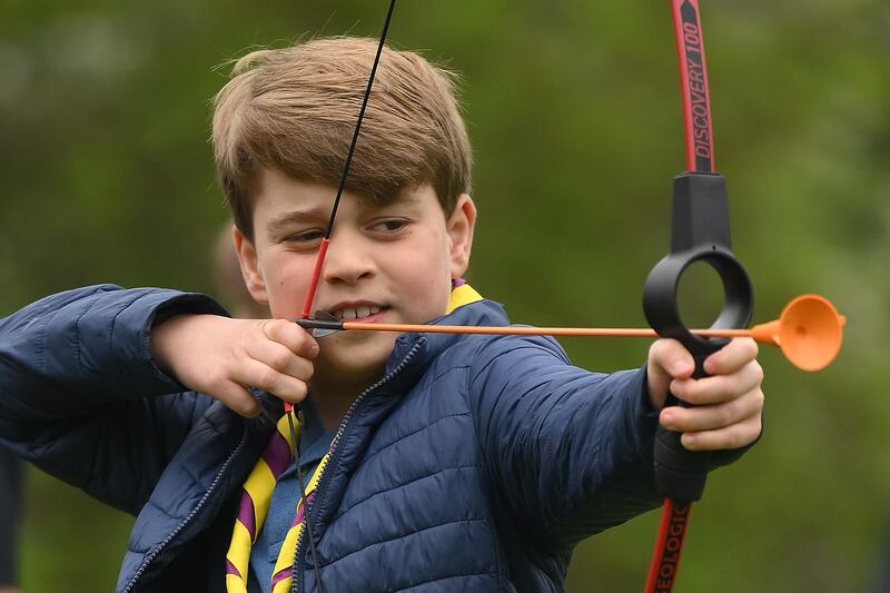 Prince George of Wales tries his hand at archery at the 3rd Upton Scouts Hut, in Slough, near London. Getty