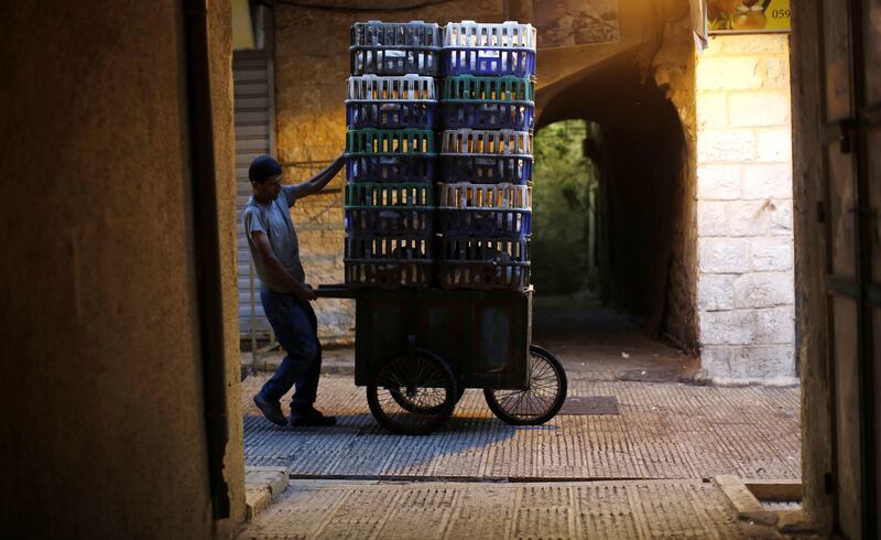 A Palestinian vendor prepares his goods to sell for Eid Al Adha. Alaa Badarneh / EPA