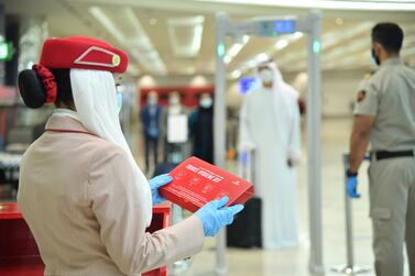Emirates is giving all travellers hygiene kits containing gloves and face masks. Travellers from several destinations must also take a Covid-19 test before boarding Emirates flights. 