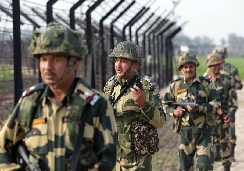 epa07403970 Indian Border Security Force (BSF) soldiers patrol along the fence somewhere at the India-Pakistan border, near Amritsar, India, 28 February 2019. Security is  tighten and on the highest alert at the Indian border area after Pakistan Army on 27 February 2019 stated it shot down two Indian fighter jets that were flying in its airspace. The incident came a day after India had claimed that its warplanes bombed a militant training camp and killed a large number of militants near the Line of Control (LoC) inside Pakistan as International community asks India, Pakistan to find diplomatic solutions.  EPA/RAMINDER PAL SINGH