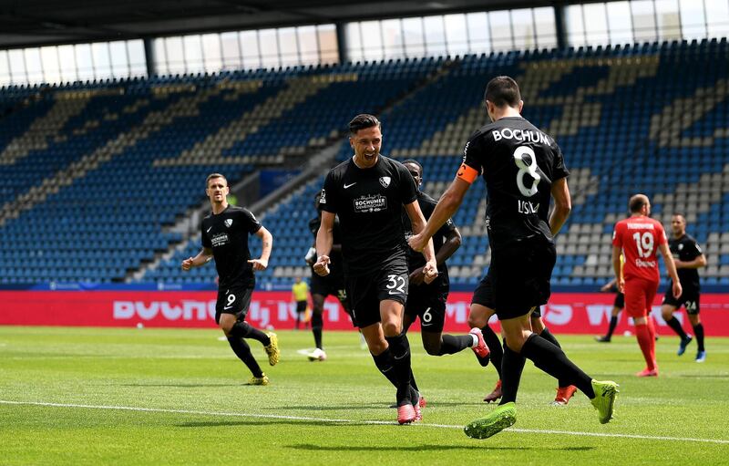 Anthony Losilla #8 of Bochum celebrate with his teammates after he scores the opening goal during the Second Bundesliga match between Bochum 1848 and Heidenheim 1846 at Vonovia Ruhrstadion on May 16, 2020 in Bochum, Germany. Getty