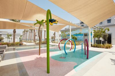 The splash pad sits beside a shaded shallow pool and behind the children's club. Photo: Emaar