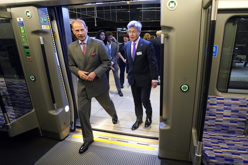 Prince Edward and Howard Smith, chief operating officer of Elizabeth Line, board one of the line's trains. PA