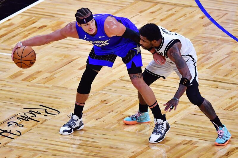 Aaron Gordon of the Orlando Magic dribbles against Kyrie Irving of the Brooklyn Nets at the Amway Centre. AFP