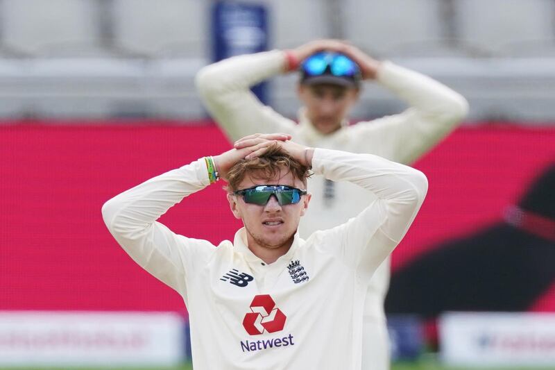 England's Dom Bess and Joe Root. Reuters