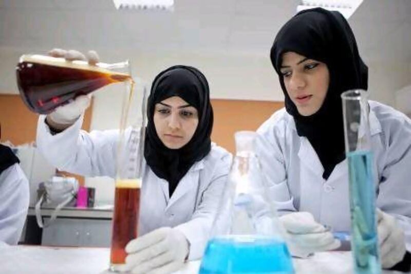 The second-year medical lab technology students Salwa Al Hamadi, 23, left, and Amal Al Hamadi, 19, in a health science lab class.