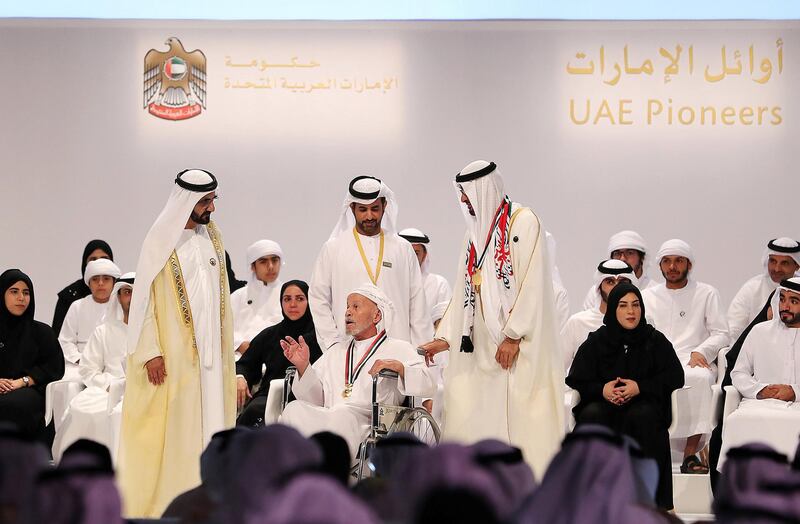 ABU DHABI , UNITED ARAB EMIRATES , NOV 28  – 2017 :- Sheikh Mohammed Bin Rashid Al Maktoum ,  Vice President and Prime Minister of the UAE , and ruler of the Dubai ( left ) and Sheikh Mohammed Bin Zayed Al Nahyan , Crown Prince of Abu Dhabi and Deputy Supreme Commander of the UAE Armed Forces ( right ) giving awards to Saif Al Mansoori ( 105 years old ) from Abu Dhabi  during the UAE Pioneers awards ceremony held at St Regis hotel on Saadiyat island in Abu Dhabi.  (Pawan Singh / The National) Story by Shareena