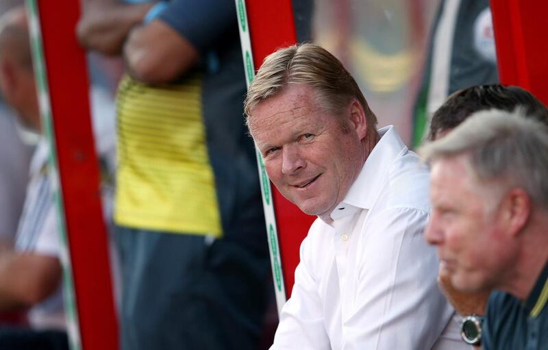 Southampton manager Ronald Koeman, pictured during a friendly against Swindon Town on July 21, 2014, in Swindon, England, says Liverpool are stronger despite having lost Luis Suarez. Scott Heavey / Getty Images
