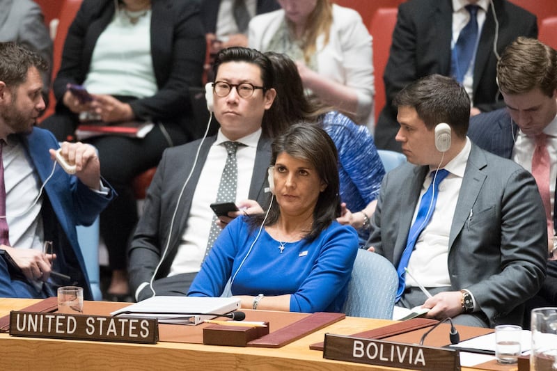 American Ambassador to the United Nations Nikki Haley listens as Syrian Ambassador to the United Nations Bashar Ja'afari speaks after a vote on a resolution during a Security Council meeting on the situation in Syria, Saturday, April 14, 2018 at United Nations headquarters. (AP Photo/Mary Altaffer)