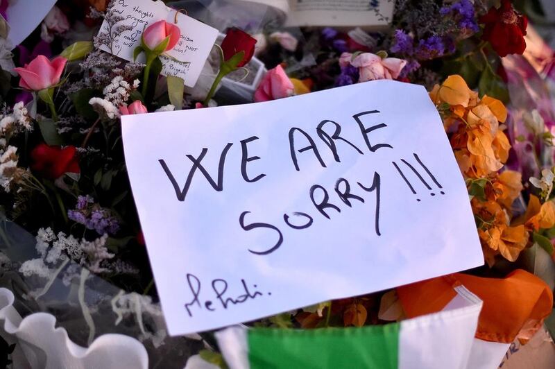 Flowers and tributes are left at Tunisia's Marhaba beach near to where 38 people were killed last week in a terrorist attack. Jeff J Mitchell / Getty Images