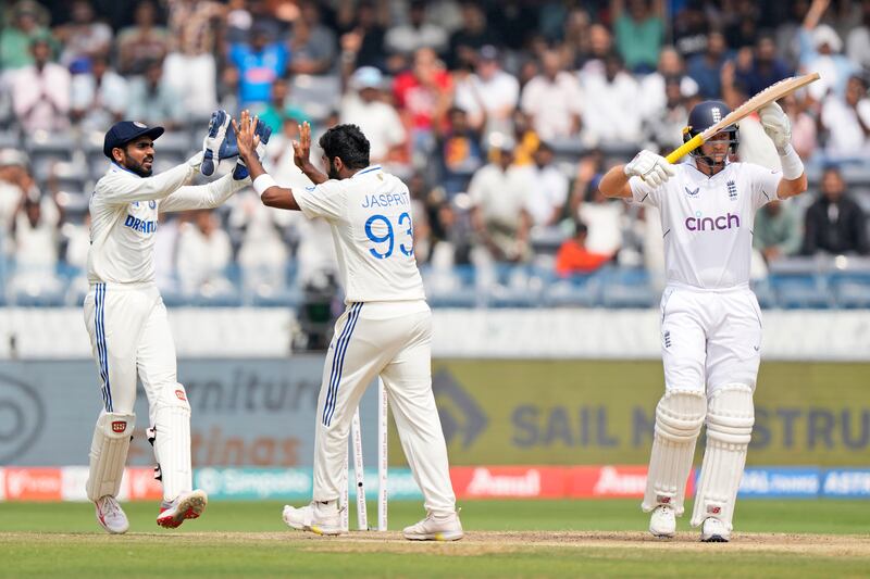India bowler Jasprit Bumrah, second left, celebrates as Joe Root, right, asks for the third umpire's review but the England batter was given out after scoring just two.