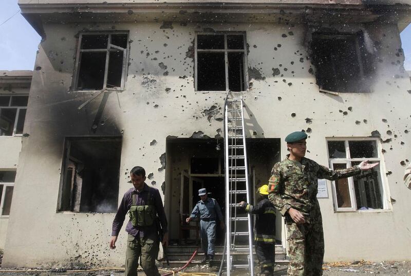 Afghan security officers arrive at the scene after Taliban fighters stormed a government building in Jalalabad province. Parwiz / Reuters