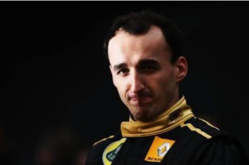 Robert Kubica, pictured here in his Lotus Renault GP driving suit, is still recovering from injuries that curtailed his Formula One career. The Pole will try running in second tier European and World Rally championships as a means to rally himself.
