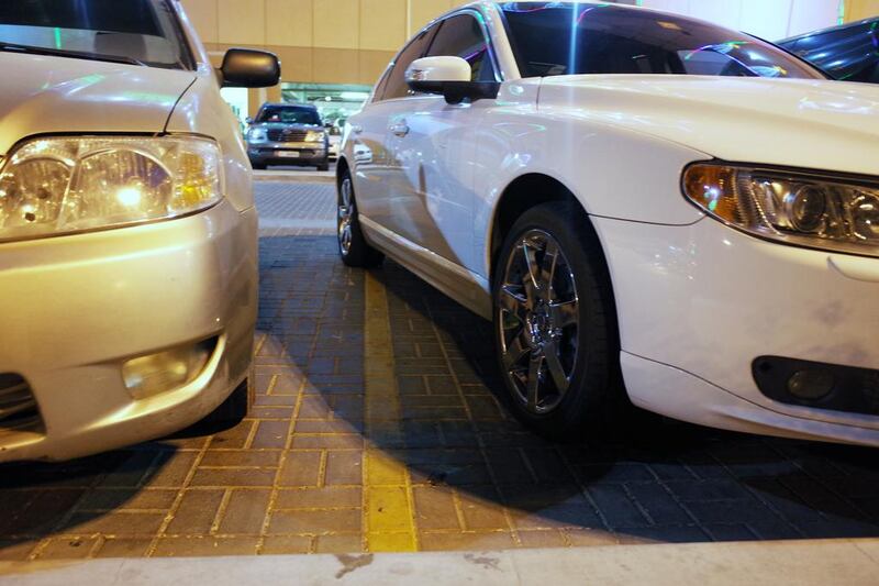 Some drivers park haphazardly at the malls after iftar, which can lead to one vehicle taking up two spaces or parking too closely to another vehicle.  Delores Johnson / The National