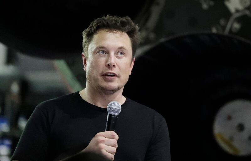 FILE- In this Sept. 17, 2018, file photo Tesla CEO and SpaceX founder and chief executive Elon Musk speaks after announcing Japanese billionaire Yusaku Maezawa as the first private passenger on a trip around the moon in Hawthorne, Calif. Tesla Inc. reports earnings on Wednesday, Oct. 24. (AP Photo/Chris Carlson, File)