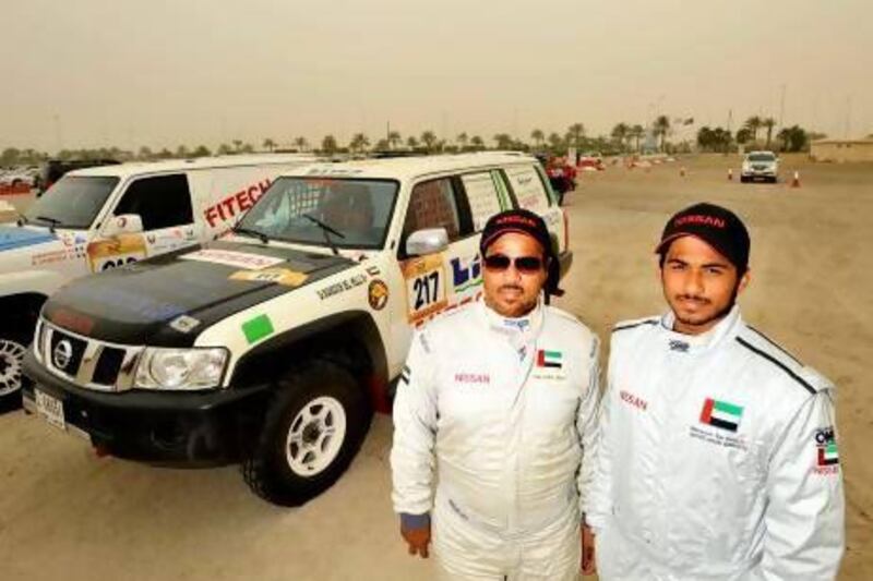 Yahya Al Helei, left, and his son Mansour are the present and future of UAE motorsport. Charles Crowell for The National